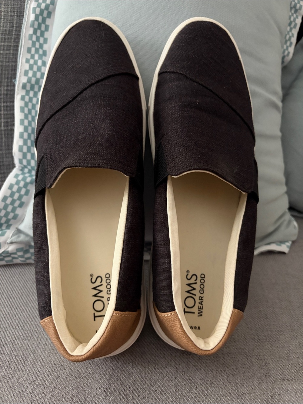 Toms Black Canvas Slip-Ons with Brown Heel Accent